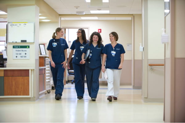 Nurses walking in hospital hallway