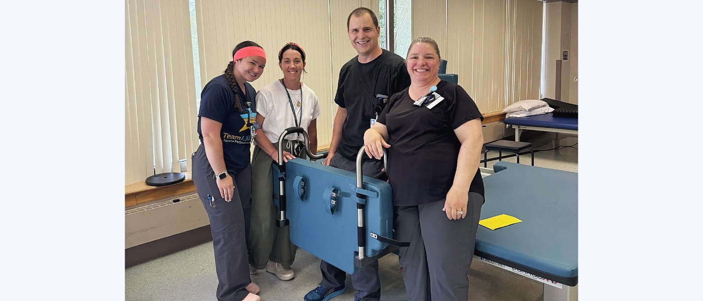 Rehab therapy team with a Barihab mat