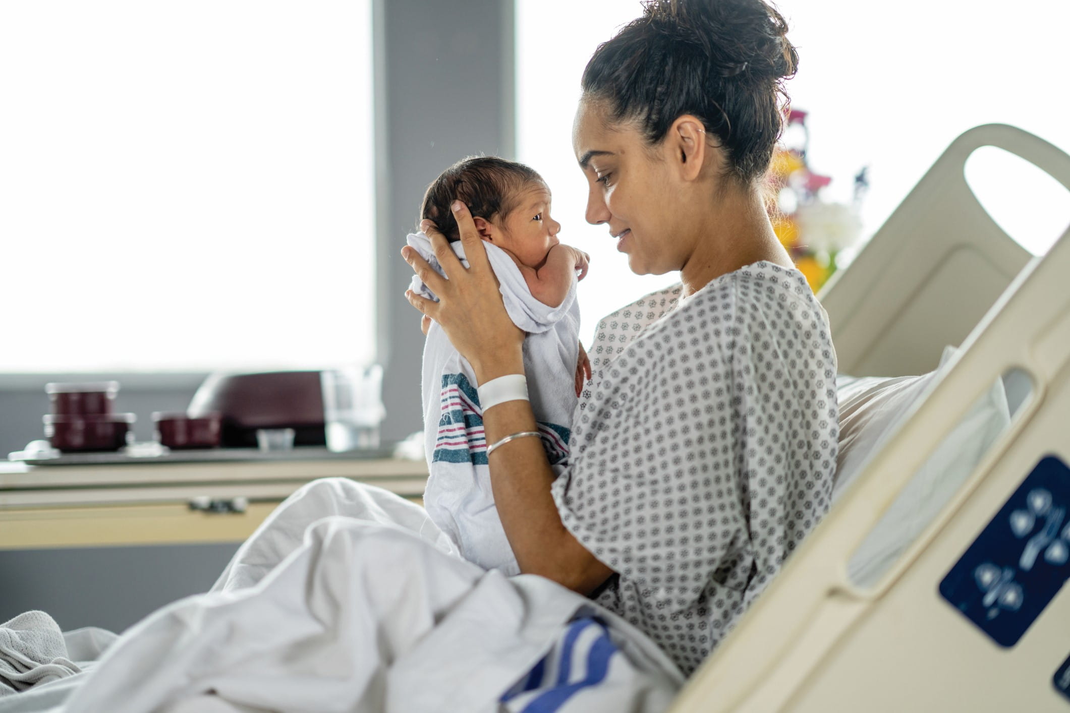 New mother and baby in hospital room